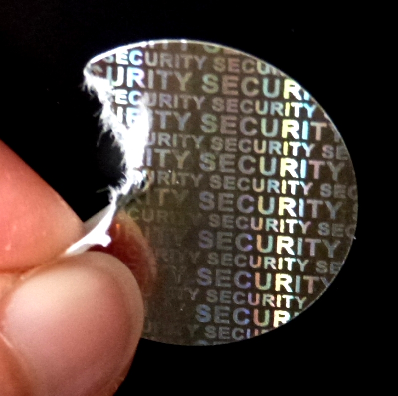 Silbernes Security-Hologramm aus zerreißbarem Papier zum Versiegeln und Verschließen 