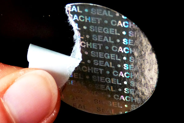 Silbernes Hologrammpapier mit dem Hologramm-Endlostext Siegel-Seal-Cachet