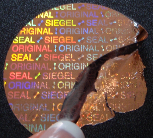 Hologramm-Siegel Kupfer mit Sicherheitseffekt, der bei Ablöseversuchen das Siegel unwiderruflich zerstört