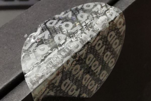 Void-Transparent-Siegel zum Schutz vor unerlaubtem Öffnen Transparente Sicherheitssiegel, bei denen eine Manipulation bei Ablöseversuchen sichtbar wird